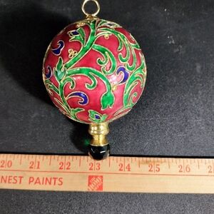 Elegant Red and Green Ornament with Gold Detailing